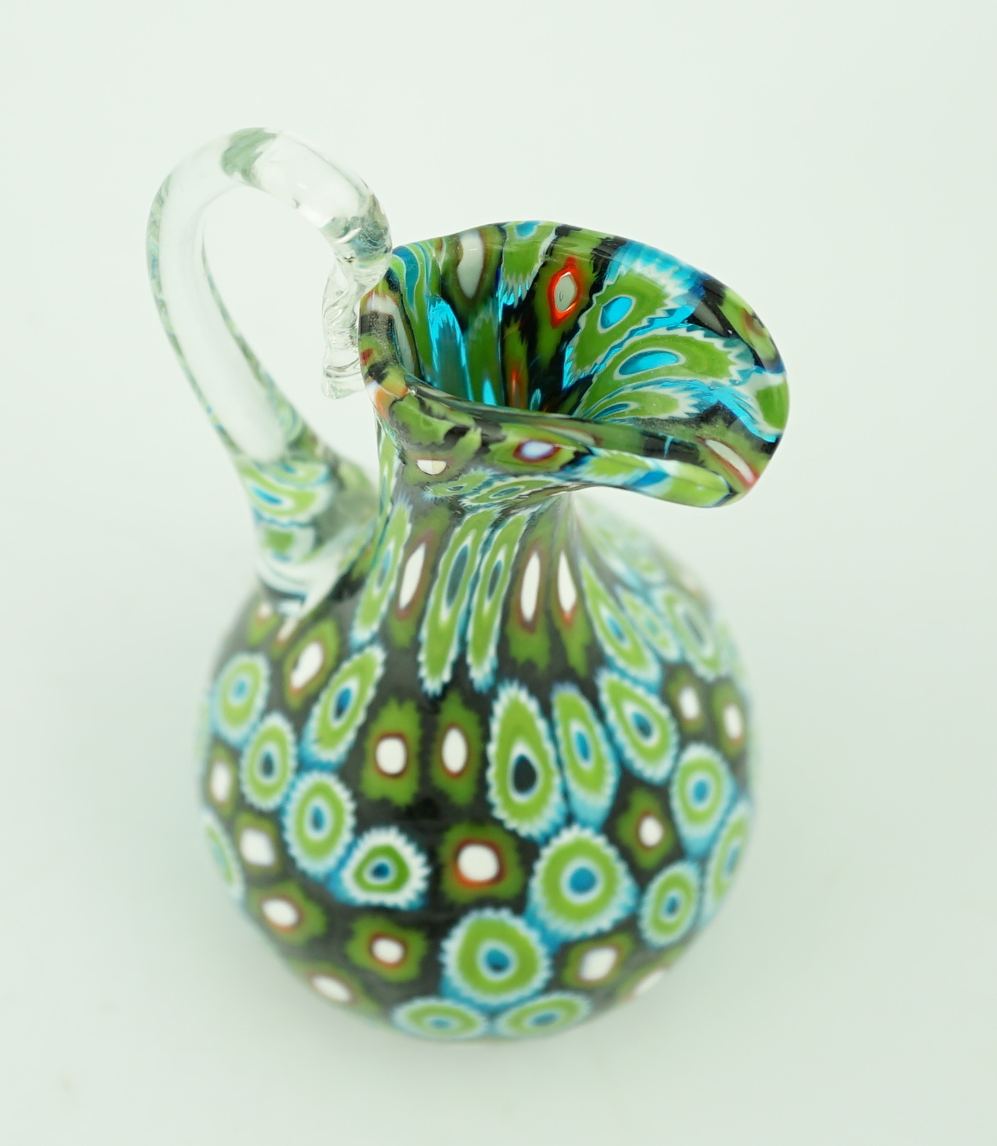 A Murano glass Murrine carafe and stopper, unsigned, 23cm, Please note this lot attracts an additional import tax of 20% on the hammer price